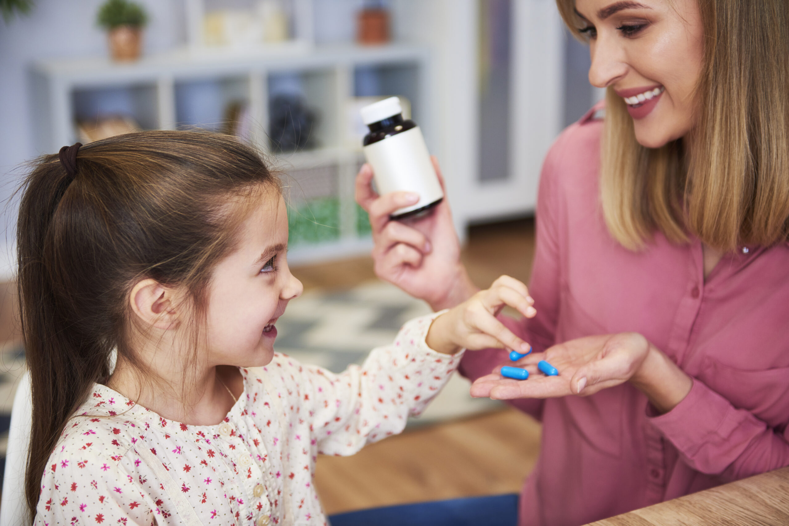 young mum giving her little daughter medicine scaled GAPP Program